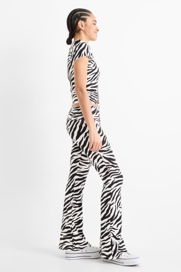 Women - Flared leggings - patterned - black / white