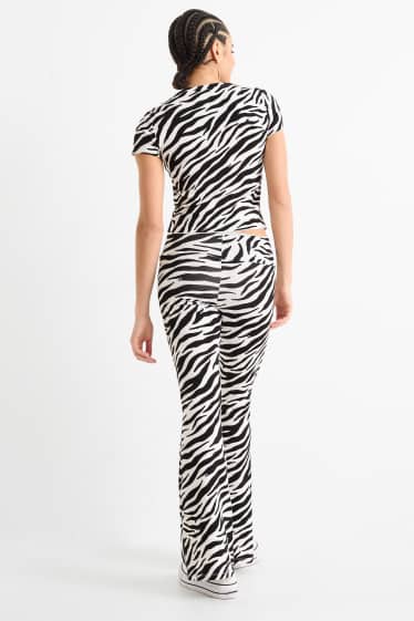 Women - Flared leggings - patterned - black / white