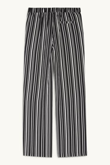 Women - Cloth trousers - high waist - wide leg - striped - black / white