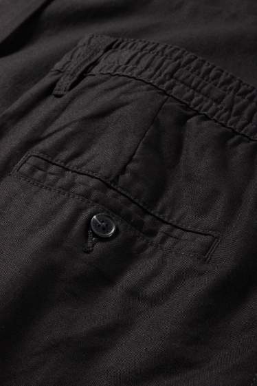 Uomo - Pantaloni cargo - tapered fit - nero