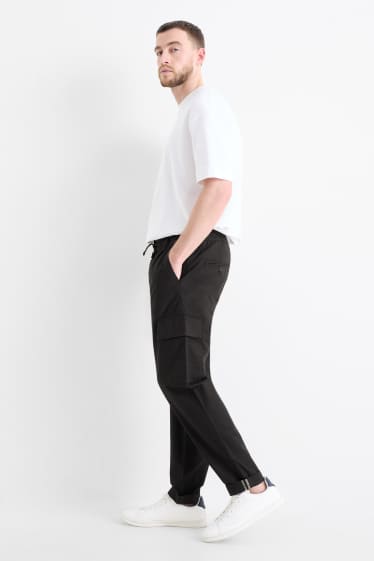 Uomo - Pantaloni cargo - tapered fit - nero