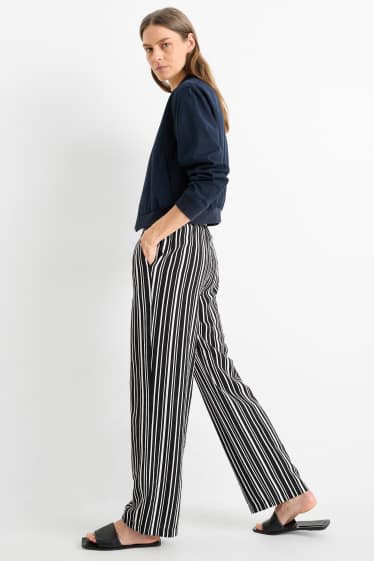 Women - Cloth trousers - high waist - wide leg - striped - black / white