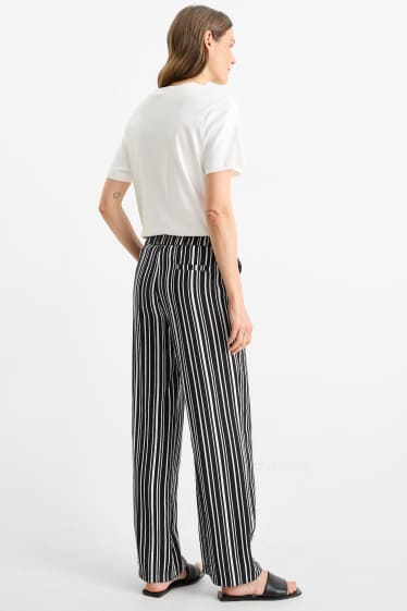 Women - Cloth trousers - high waist - wide leg - striped - black / white