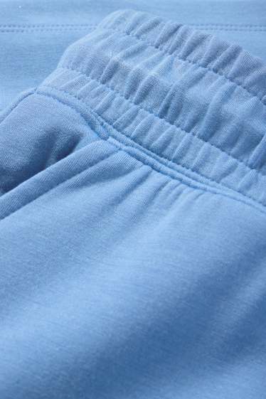 Dona - Pantalons curts tècnics - blau clar