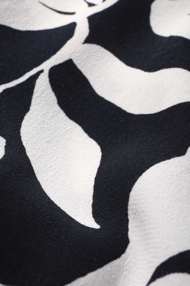 Femmes - Pantalon en toile - mid waist - wide leg - motif - texturé - bleu foncé / blanc crème