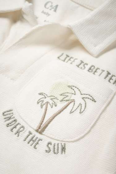 Neonati - Motivo palma - polo neonati - bianco crema