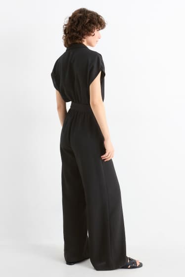 Damen - Jumpsuit mit Gürtel - schwarz