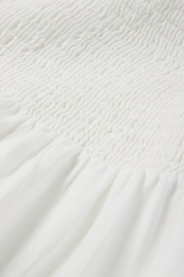 Damen - A-Linien Kleid - Broderie Anglaise - gesmokt - weiß