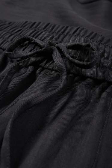 Femmes - Pantalon en toile - mid waist - tapered fit - noir