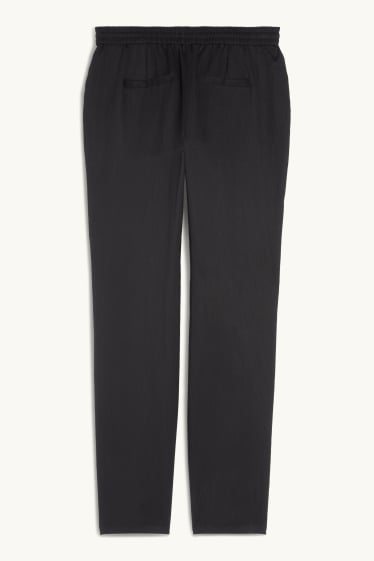 Femmes - Pantalon en toile - mid waist - tapered fit - noir
