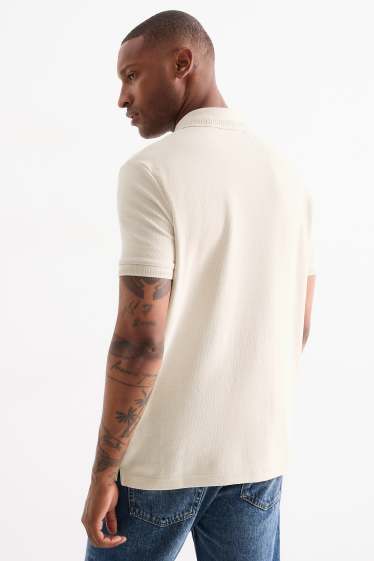 Hommes - Polo en maille - regular fit - finition texturée - beige