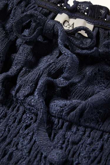 Dames - Korte top - broderie Anglaise - gesmokt - donkerblauw