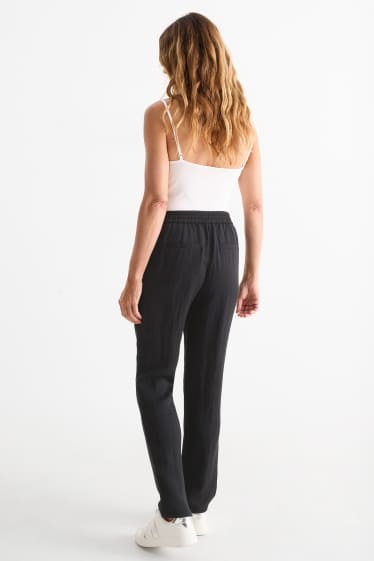Femmes - Pantalon en toile - mid waist - tapered fit - noir