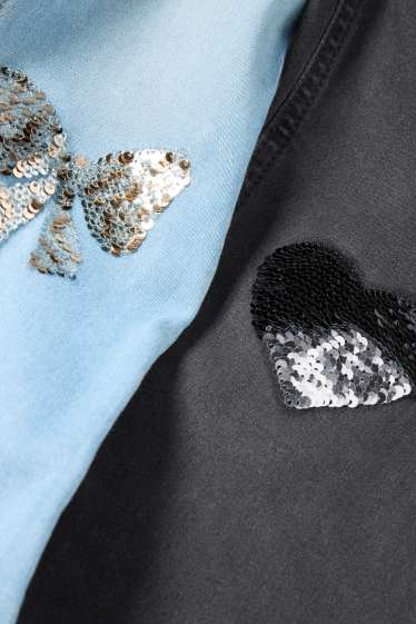 Kinderen: meisjes - Set van 2 - hart en strik - flared jeans - zwart