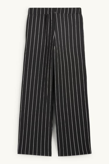Dames - Broek van jersey - mid waist - loose fit - gestreept - zwart / wit