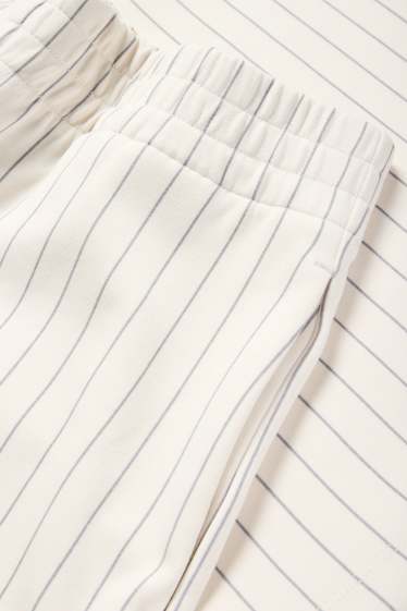 Dames - Broek van jersey - mid waist - straight fit - met strepen - crème wit
