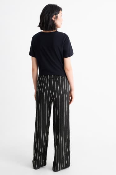 Dames - Broek van jersey - mid waist - loose fit - gestreept - zwart / wit