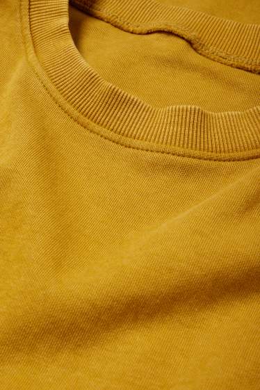Dames - T-shirt-jurk - mosterdgeel