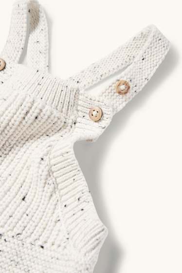 Unisex - Salopetă tricotată bebeluși - reiată - alb-crem