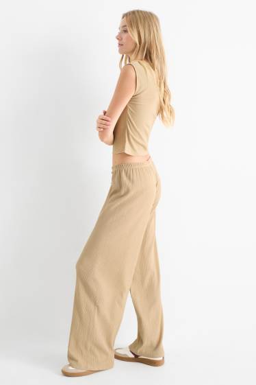 Femmes - Pantalon en jersey - mid waist - wide leg - finition texturée - beige