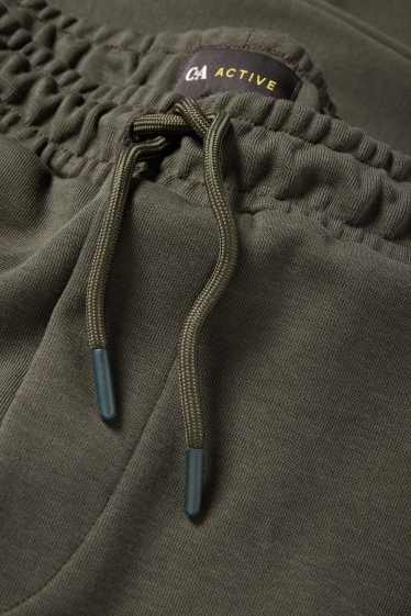 Bărbați - Pantaloni de trening funcționali - verde închis