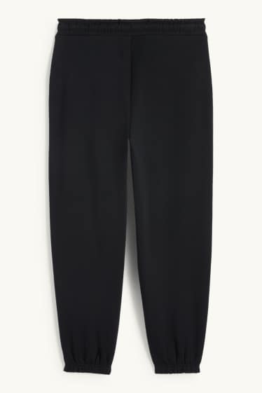 Nen - Halloween - esquelet - pantalons de xandall - brilla en la foscor - negre