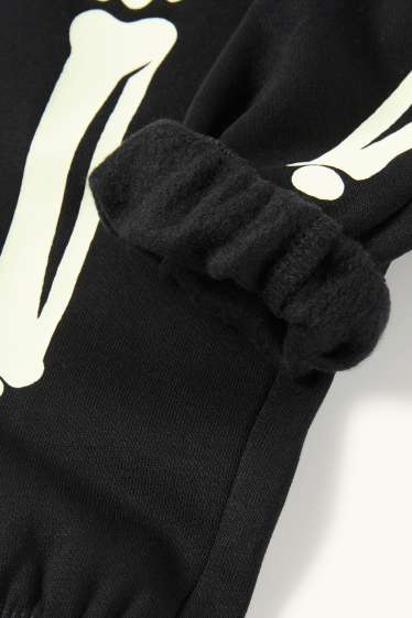 Kinderen: jongens - Halloween - skelet - joggingbroek - glow in the dark - zwart