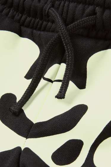Kinderen: jongens - Halloween - skelet - joggingbroek - glow in the dark - zwart