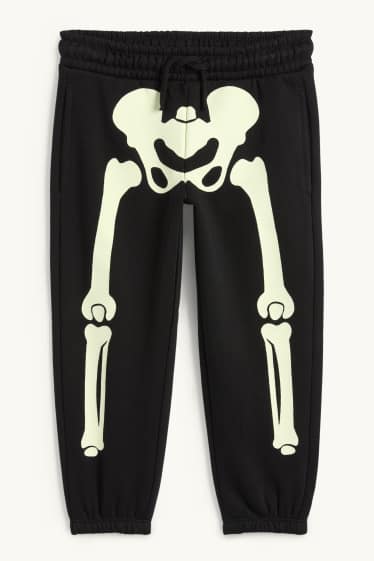 Kinderen: jongens - Halloween - skelet - joggingbroek - glow in the dark - zwart
