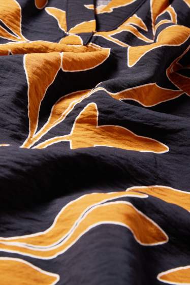 Dames - Blouse met V-hals - gebloemd - oranje / zwart