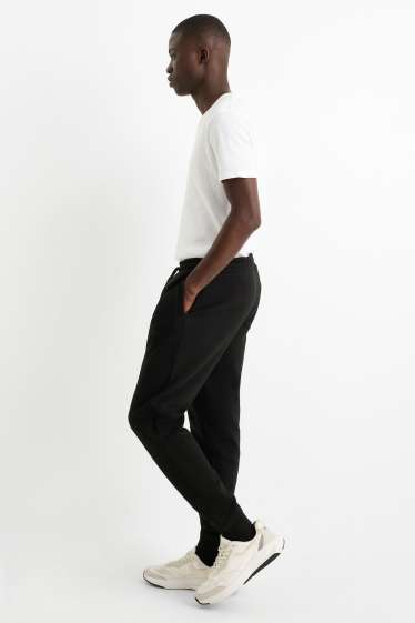 Pánské - Teplákové kalhoty - černá