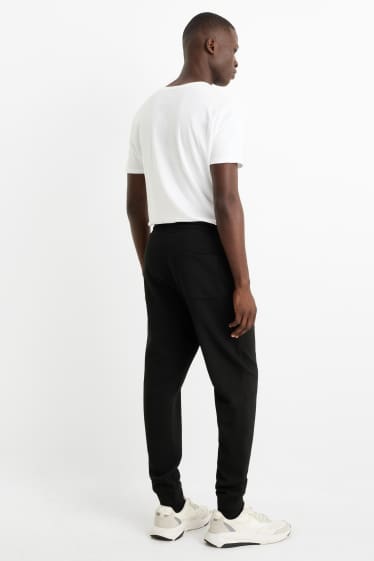 Pánské - Teplákové kalhoty - černá