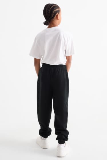 Nen - Halloween - esquelet - pantalons de xandall - brilla en la foscor - negre