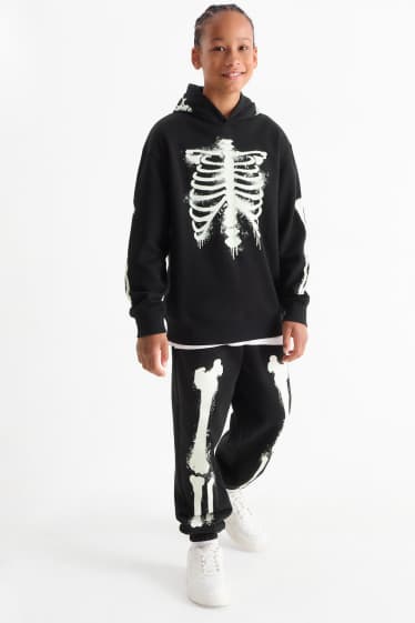 Nen - Halloween - esquelet - pantalons de xandall - brilla en la foscor - negre