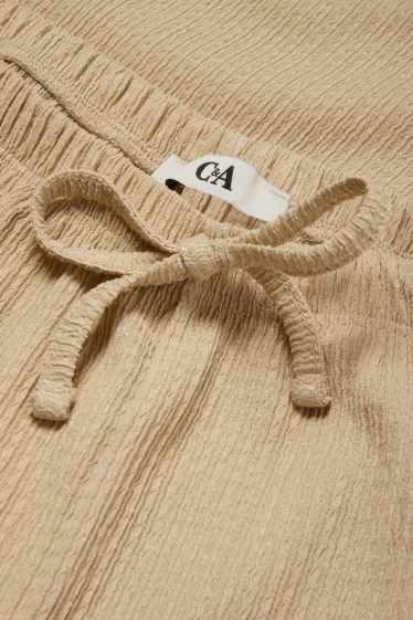 Femmes - Pantalon en jersey - mid waist - wide leg - finition texturée - beige