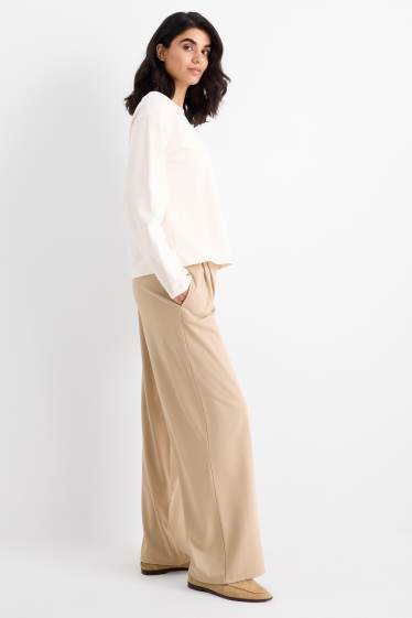 Dámské - Žerzejové kalhoty - high waist - wide leg - béžová