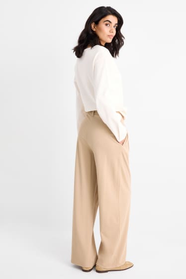 Dámské - Žerzejové kalhoty - high waist - wide leg - béžová