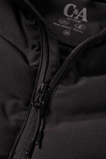 Femmes - Veste de sport chaude à capuche - finition déperlante - noir