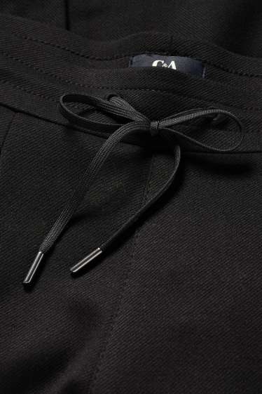 Femmes - Pantalon en jersey - mid waist - tapered fit - noir