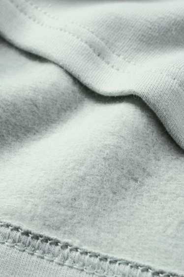 Miminka - chlapci - Dinosauři - pyžamo pro miminka - 2dílné - mátově zelená