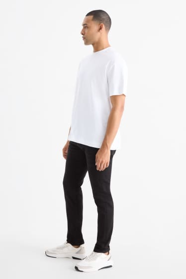 Bărbați - Slim tapered jeans - negru