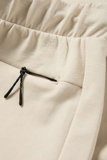 Bărbați - Pantaloni scurți de trening - structurați - bej deschis