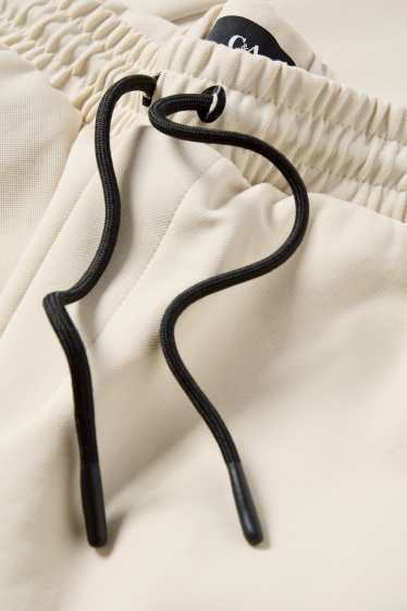 Bărbați - Pantaloni scurți de trening - structurați - bej deschis