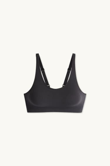 Dámské - Sportovní podprsenka - s vycpávkami - žebrovaná - bezešvá - černá