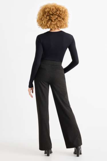 Dámské - Žerzejové kalhoty - mid waist - wide leg - s úzkými proužky - černá