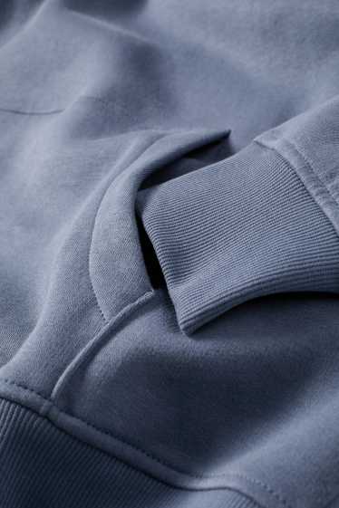 Home - Dessuadora oversized amb caputxa - blau