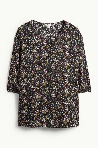 Dona - Brusa - de flors - negre