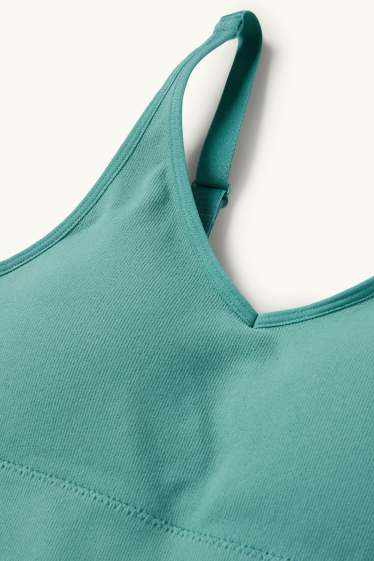 Dámské - Sportovní podprsenka - s vycpávkami - žebrovaná - bezešvá - zelená