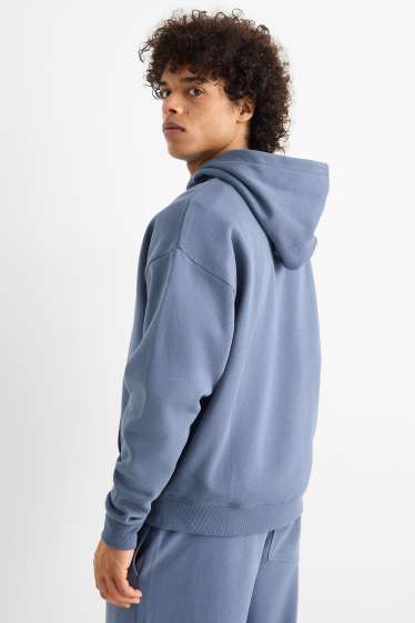 Home - Dessuadora oversized amb caputxa - blau