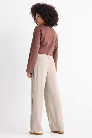 Dona - Pantalons de tela - high waist - wide leg - beix